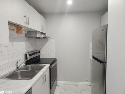 303-8800 Willoughby Drive, Niagara Falls, ON - Indoor Photo Showing Kitchen With Double Sink