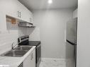 303-8800 Willoughby Drive, Niagara Falls, ON  - Indoor Photo Showing Kitchen With Double Sink 