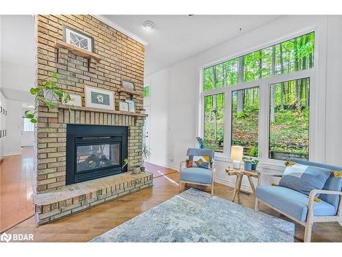 8 Frid Boulevard, Midhurst, ON - Indoor Photo Showing Living Room With Fireplace