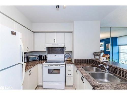 1502 W-140 Dunlop Street E, Barrie, ON - Indoor Photo Showing Kitchen With Double Sink