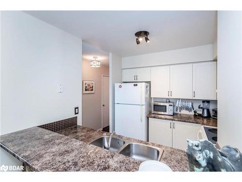 1502 W-140 Dunlop Street E, Barrie, ON - Indoor Photo Showing Kitchen With Double Sink