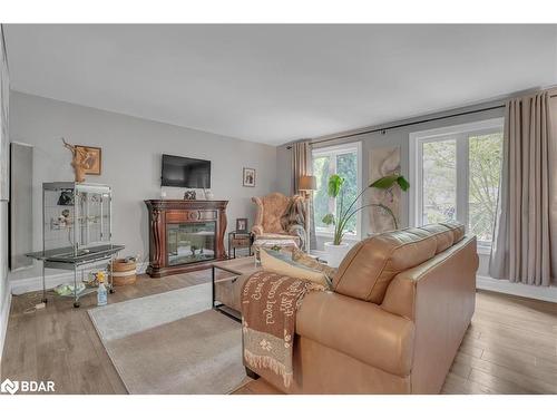 59 Withall Grove, Tiny, ON - Indoor Photo Showing Living Room With Fireplace