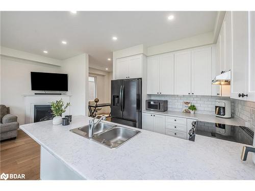 35 Povey Road, Fergus, ON - Indoor Photo Showing Kitchen With Fireplace With Double Sink