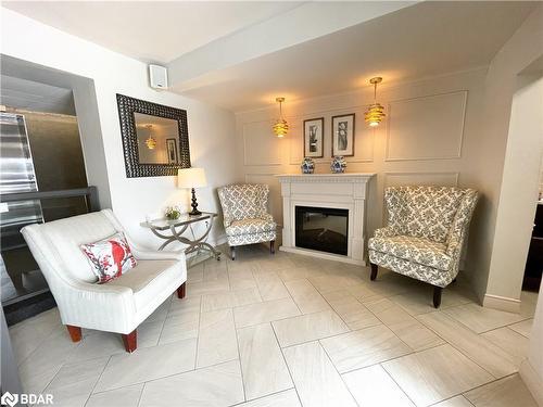 702-414 Blake Street, Barrie, ON - Indoor Photo Showing Living Room With Fireplace