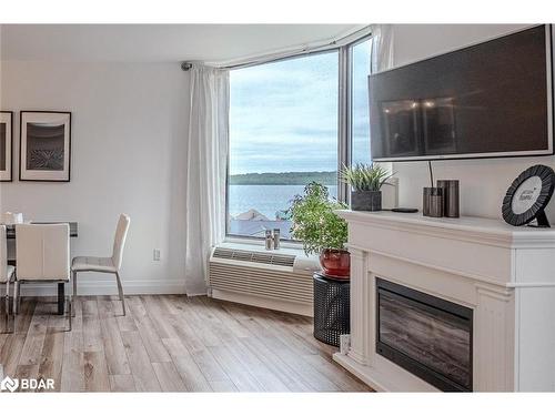 504-181 Collier Street, Barrie, ON - Indoor With Fireplace