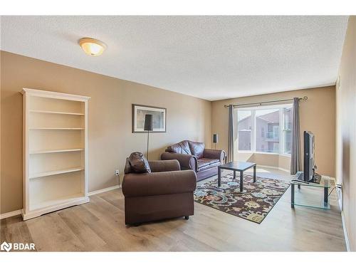 303-107 Bond Street, Orillia, ON - Indoor Photo Showing Living Room