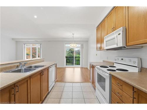 204-443 Centennial Forest Drive, Milton, ON - Indoor Photo Showing Kitchen With Double Sink