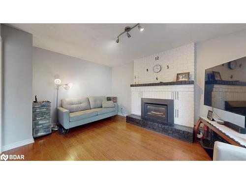 4 Trillium Crescent, Barrie, ON - Indoor Photo Showing Living Room With Fireplace