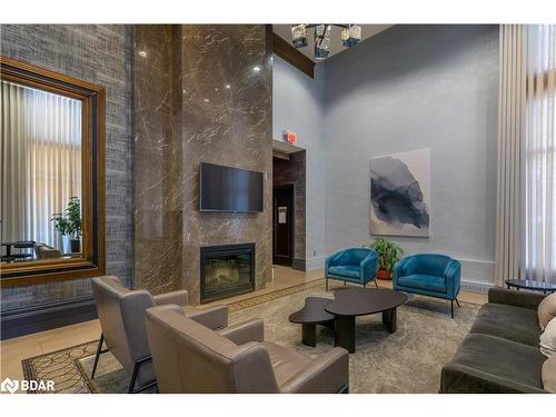 307-385 Prince Of Wales Drive, Mississauga, ON - Indoor Photo Showing Living Room With Fireplace