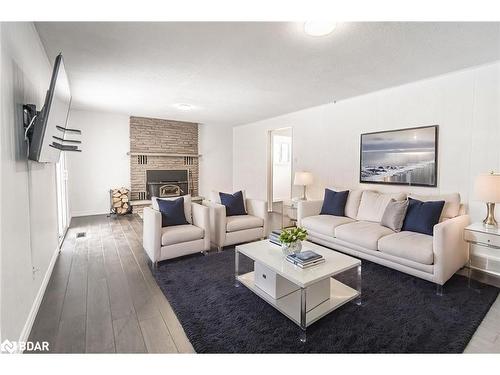 5853 Yonge Street, Innisfil, ON - Indoor Photo Showing Living Room With Fireplace