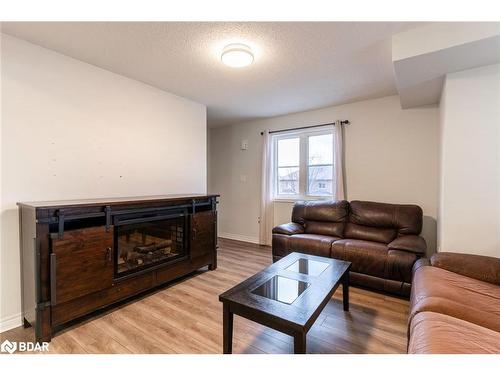 2-141 Sydenham Wells, Barrie, ON - Indoor Photo Showing Living Room With Fireplace