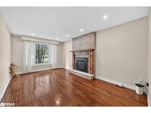 15 Rodney Street, Barrie, ON - Indoor Photo Showing Living Room With Fireplace