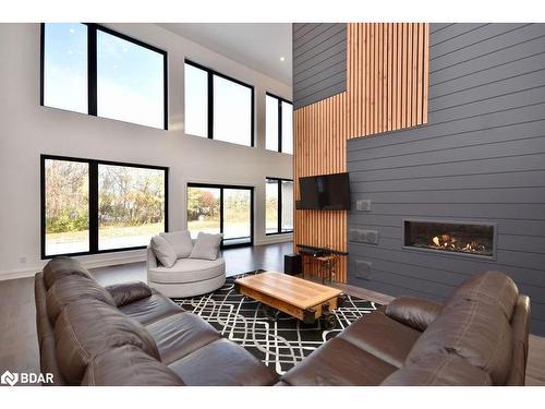 57 Glenhuron Drive, Springwater, ON - Indoor Photo Showing Other Room With Fireplace