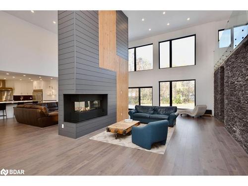57 Glenhuron Drive, Springwater, ON - Indoor Photo Showing Living Room With Fireplace