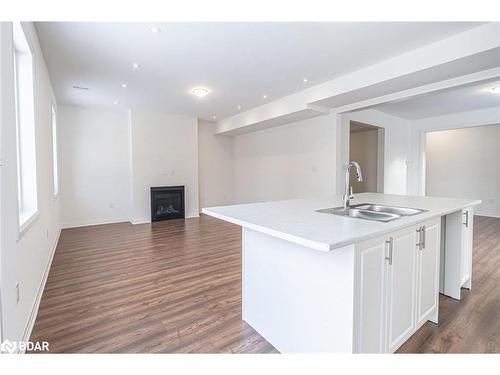 112 West Oak Trail, Barrie, ON - Indoor Photo Showing Kitchen With Fireplace With Double Sink