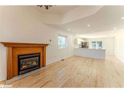 Upper-9 Kestrel Court, Barrie, ON - Indoor Photo Showing Living Room With Fireplace