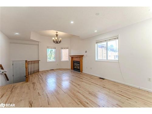 Upper-9 Kestrel Court, Barrie, ON - Indoor Photo Showing Living Room With Fireplace
