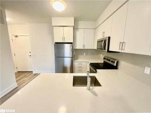 303-1100 Lackner Place, Kitchener, ON - Indoor Photo Showing Kitchen With Stainless Steel Kitchen With Double Sink