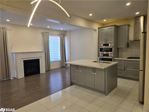 8 Beasley Grove, Ancaster, ON - Indoor Photo Showing Kitchen With Fireplace With Upgraded Kitchen