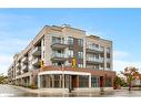 207-123 Maurice Drive, Oakville, ON  - Outdoor With Facade 