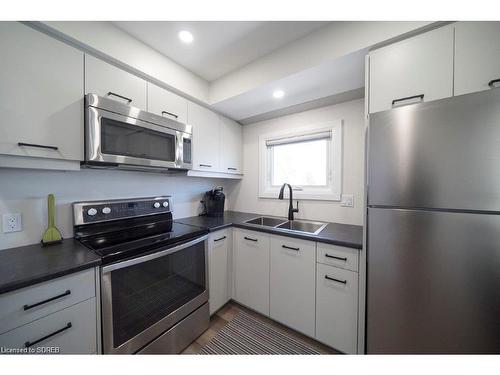 219 Cedar Drive, Turkey Point, ON - Indoor Photo Showing Kitchen With Double Sink