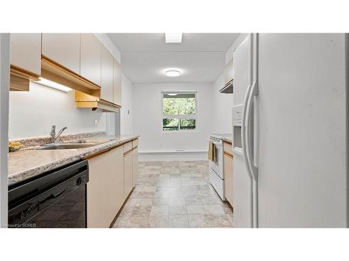 201-5 Mill Pond Court, Simcoe, ON - Indoor Photo Showing Kitchen With Double Sink