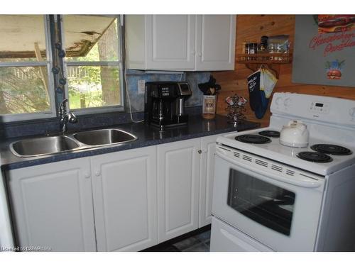 303 Erie Boulevard, Long Point, ON - Indoor Photo Showing Kitchen With Double Sink