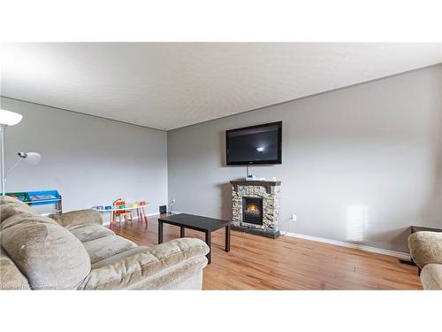 18 Rutherford Drive, Simcoe, ON - Indoor Photo Showing Living Room With Fireplace