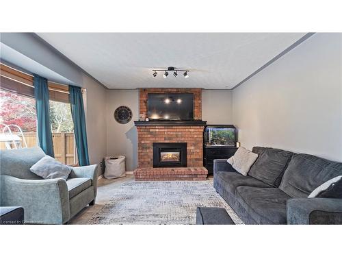 18 Rutherford Drive, Simcoe, ON - Indoor Photo Showing Living Room With Fireplace