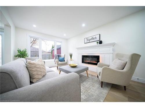 42 Falls Crescent, Simcoe, ON - Indoor Photo Showing Living Room With Fireplace