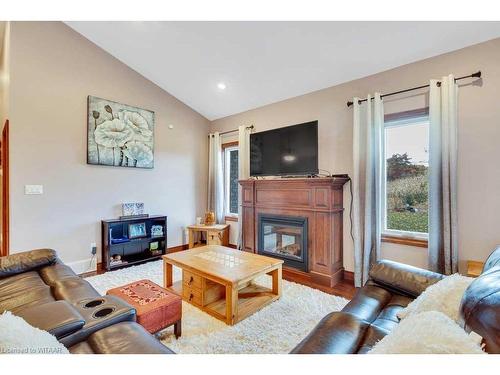 59 Windham 11 Road, La Salette, ON - Indoor Photo Showing Living Room With Fireplace