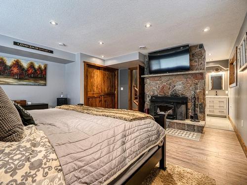 924022 92 Road, Embro, ON - Indoor Photo Showing Bedroom With Fireplace