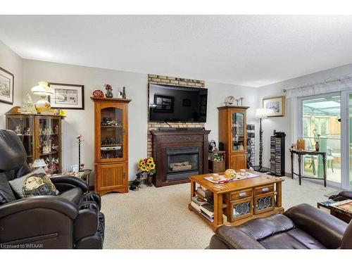 18 Hawkins Crescent, Tillsonburg, ON - Indoor Photo Showing Living Room With Fireplace