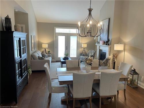 202-5 Wood Haven Drive, Tillsonburg, ON - Indoor Photo Showing Dining Room With Fireplace