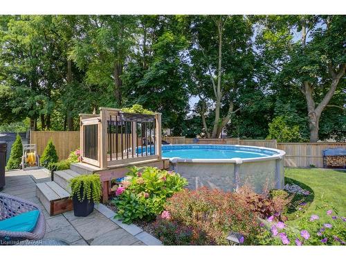 138 Dover Street, Woodstock, ON - Outdoor With Above Ground Pool With Backyard