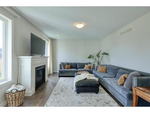 59 Hollingshead Road, Ingersoll, ON - Indoor Photo Showing Living Room With Fireplace