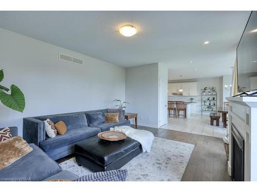 59 Hollingshead Road, Ingersoll, ON - Indoor Photo Showing Living Room With Fireplace