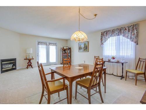 18 Brasher Drive, Tillsonburg, ON - Indoor Photo Showing Dining Room With Fireplace