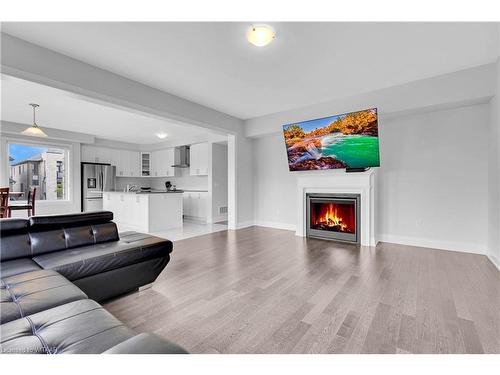 138 Prince Charles Crescent, Woodstock, ON - Indoor Photo Showing Living Room With Fireplace