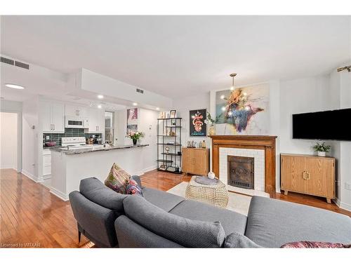 204-275 Queens Avenue, London, ON - Indoor Photo Showing Living Room With Fireplace