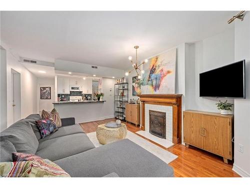 204-275 Queens Avenue, London, ON - Indoor Photo Showing Living Room With Fireplace