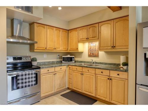 2-144 Concession Street E, Tillsonburg, ON - Indoor Photo Showing Kitchen With Double Sink