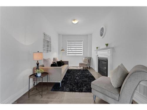 798 Queenston Blvd Boulevard, Woodstock, ON - Indoor Photo Showing Living Room With Fireplace