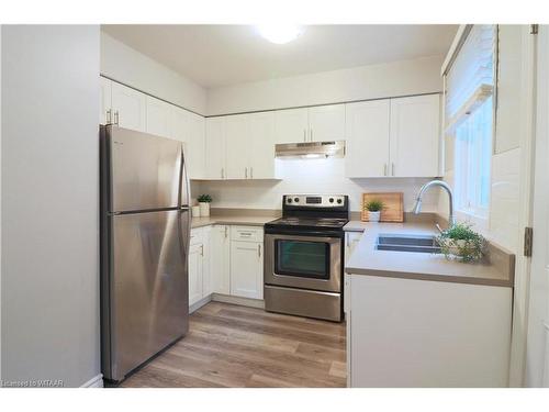 7-388 Springbank Avenue N, Woodstock, ON - Indoor Photo Showing Kitchen With Double Sink