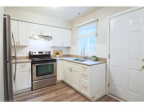 7-388 Springbank Avenue N, Woodstock, ON - Indoor Photo Showing Kitchen With Double Sink