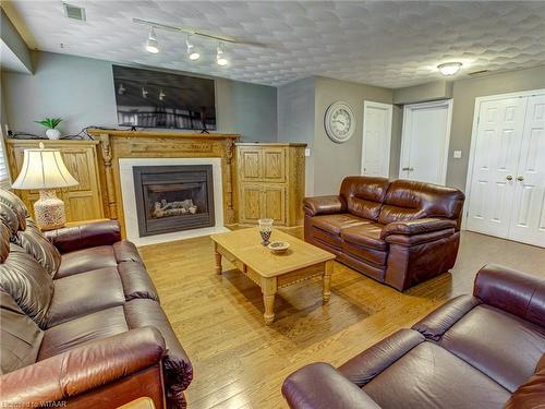 10 Blackfoot Place, Woodstock, ON - Indoor Photo Showing Living Room With Fireplace