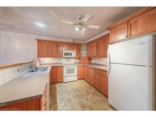 18-53 Herons Landing Crescent, Woodstock, ON - Indoor Photo Showing Kitchen With Double Sink