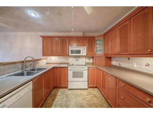 18-53 Herons Landing Crescent, Woodstock, ON - Indoor Photo Showing Kitchen With Double Sink