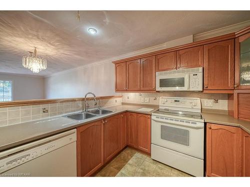 18-53 Herons Landing Crescent, Woodstock, ON - Indoor Photo Showing Kitchen With Double Sink