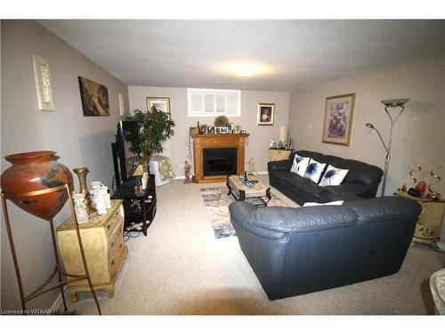 5-150 Oak Street, Simcoe, ON - Indoor Photo Showing Living Room With Fireplace